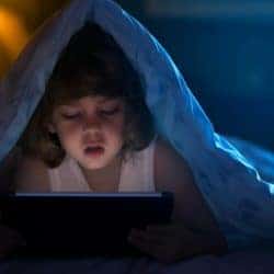 How to protect kids on YouTube with the Kids app, parental controls, and more Little boy watching cartoons at night