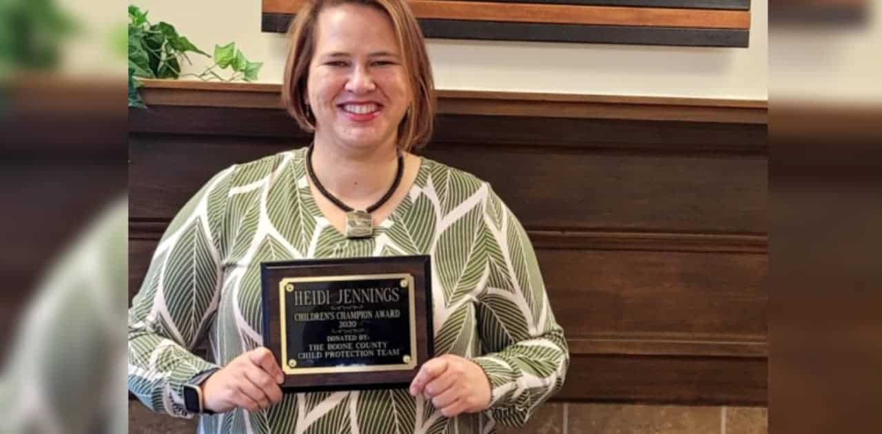 Photo of Heidi Jennings holding award