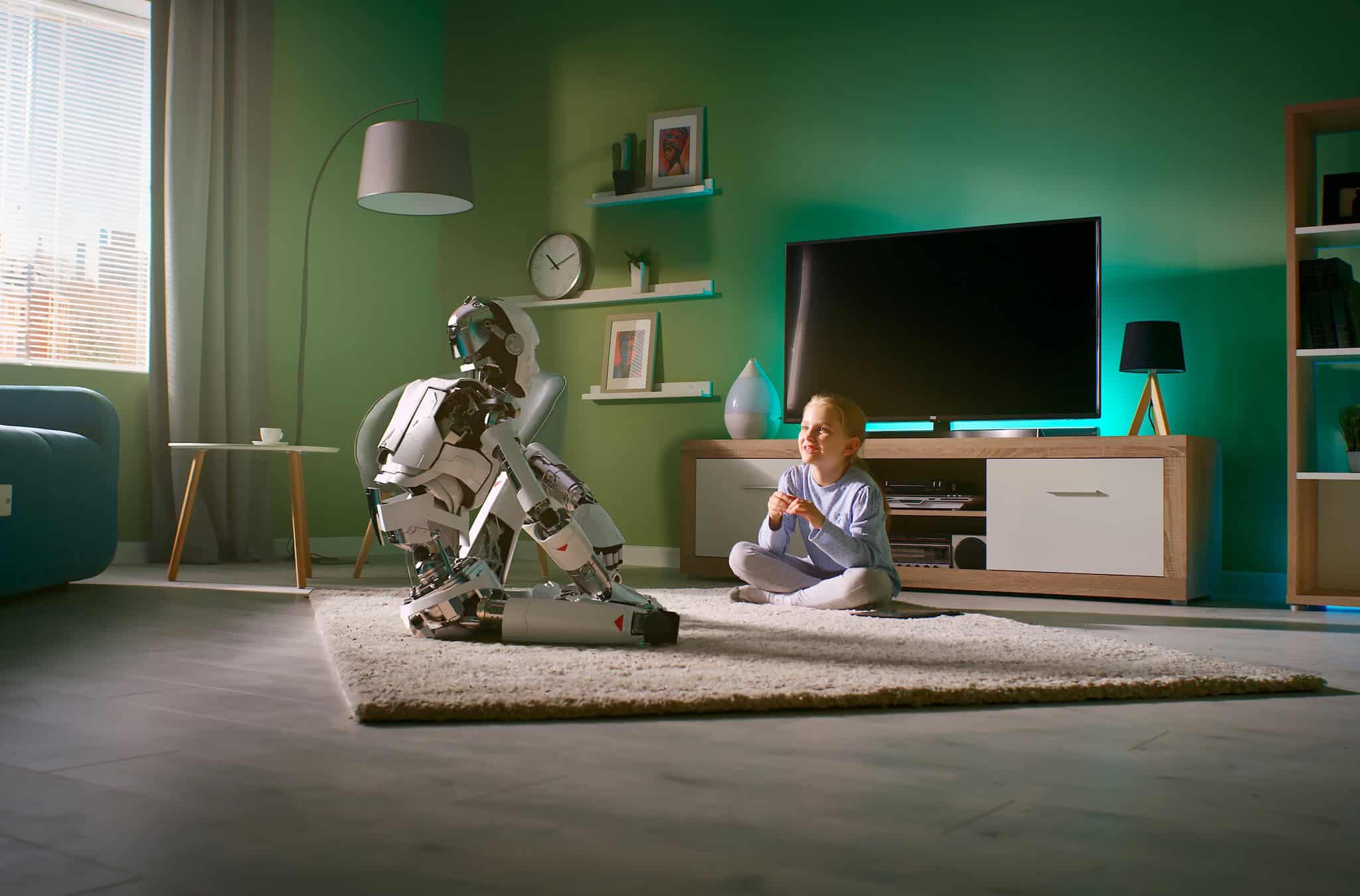 Girl speaking with robotic friend at home