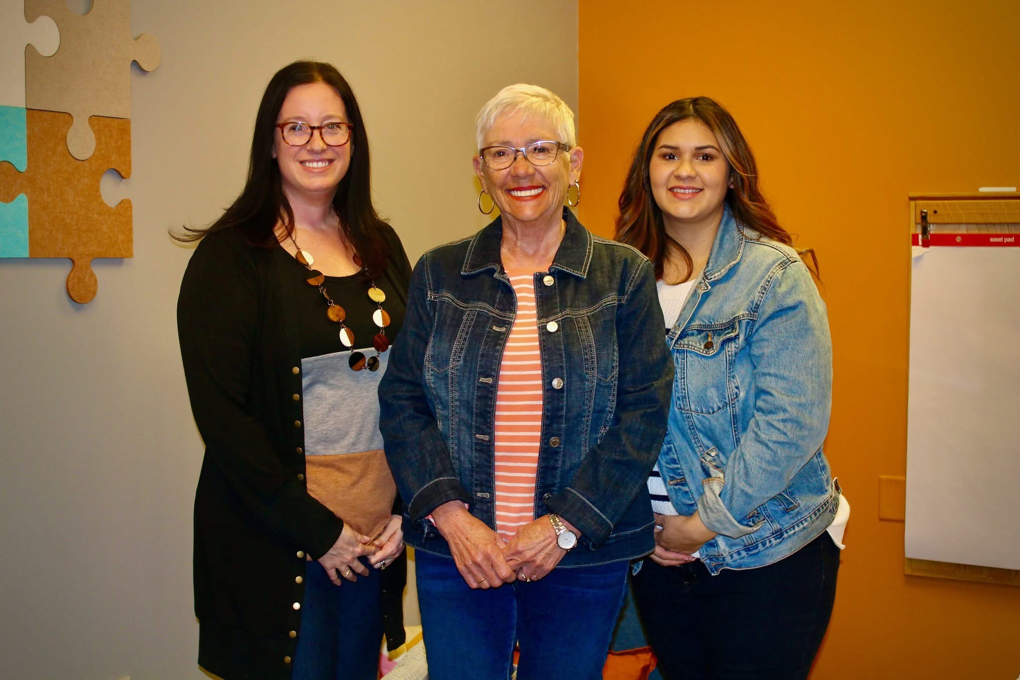 Pat Smallwood poses with staff members