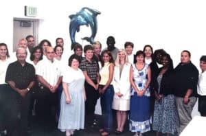 Pat Smallwood poses with a group of colleagues